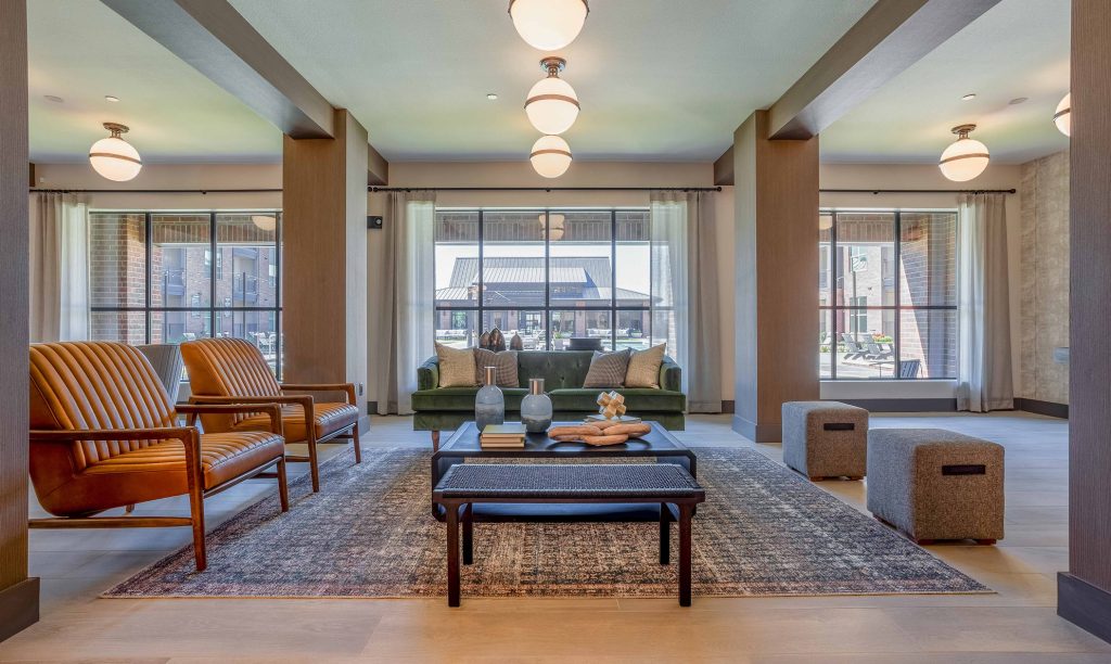A mobile image of a sofa set with a beautiful carpet